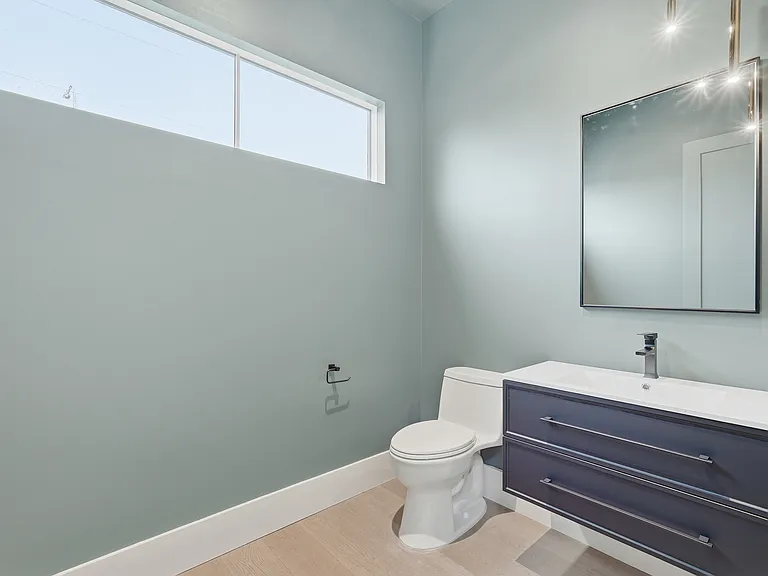 Modern bathroom with sleek vanity, clean finishes, and natural light.