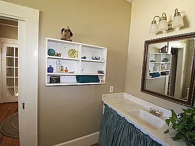 Upstairs bath has sink area separate from shower/toilet