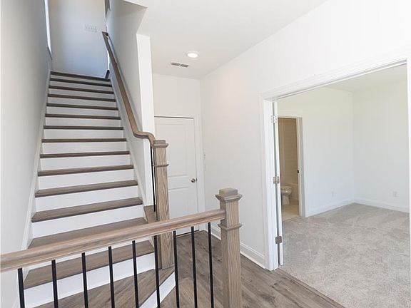 Terrace Level entry and stairs. Photos are not of actual home but of previously built home - home i