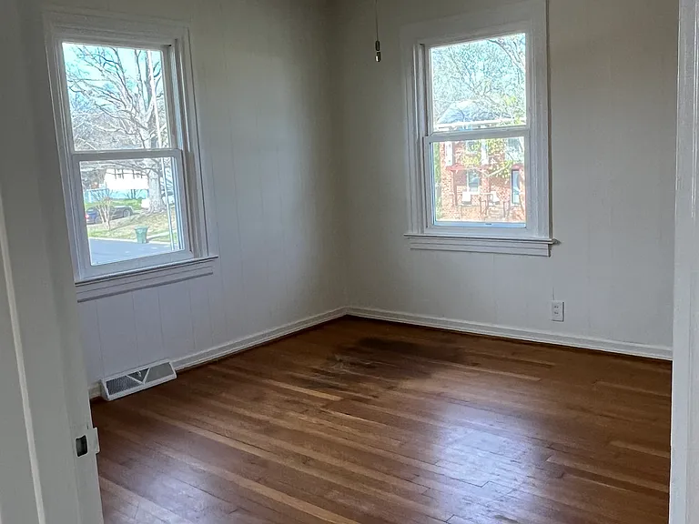 Primary bedroom with a ceiling fan.