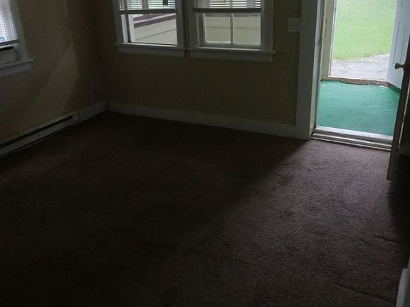 Living room looking out to enclosed front porch area