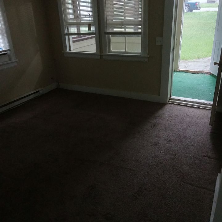 Living room looking out to enclosed front porch area