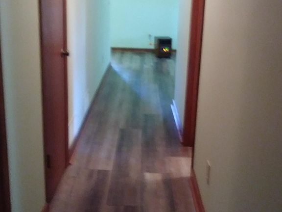 Hallway from living room to hall bath and the 2 bedrooms