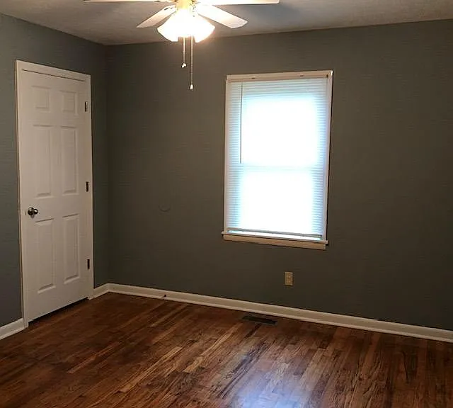 Bedroom 1 has one window. Closet door on left.