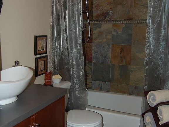 Dramatic Guest Bath w/ natural slate & floating sink