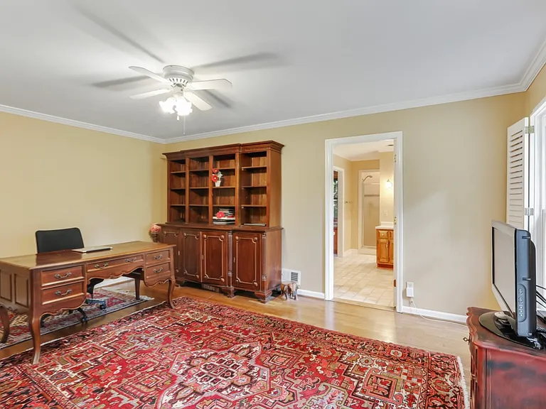 The main master bedroom with access to the suite bathroom and its walking closet. This room used to be office during COVID.