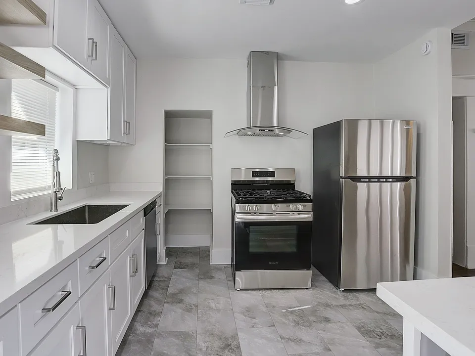 View of stainless-steel appliances and pantry. More counter space!