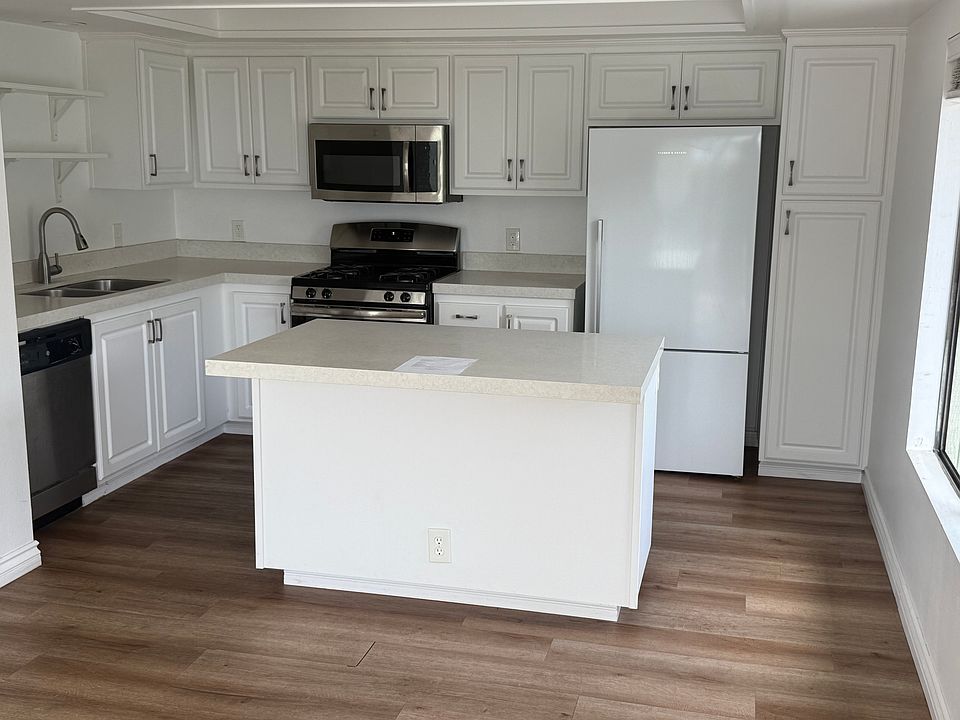 Kitchen with gas stove and amazing refrigerator