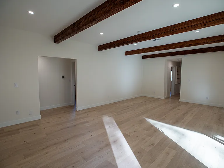 Tons of light with the natural beams, canned lights and windows. New flooring throughout.