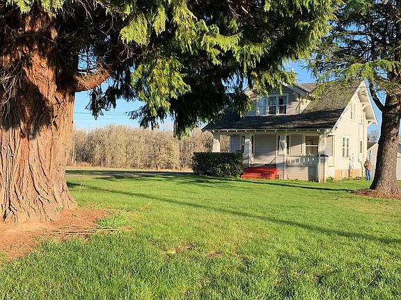 from road view of front yard with its beautiful big trees
