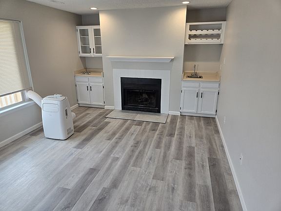 Brand New LVP Flooring. Easy to clean. Waterproof. Brand new Fireplace tile also installed. 

BIG Family room with 10,000 BTU Air Conditioner for your use!