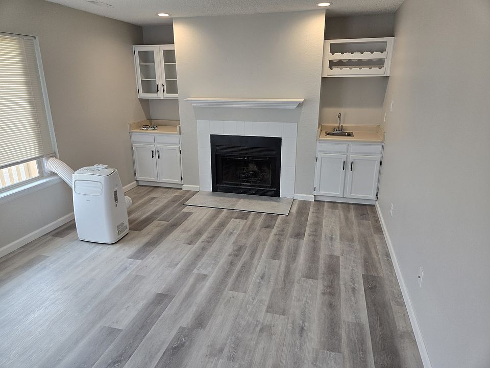 Brand New LVP Flooring. Easy to clean. Waterproof. Brand new Fireplace tile also installed. 

BIG Family room with 10,000 BTU Air Conditioner for your use!