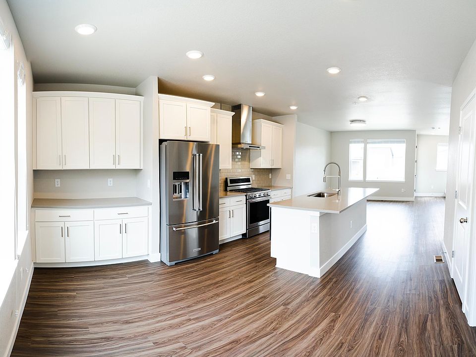 Main level (2nd floor): Dining area, Kitchen, Pantry, Living area, Balcony, 1/2 bath