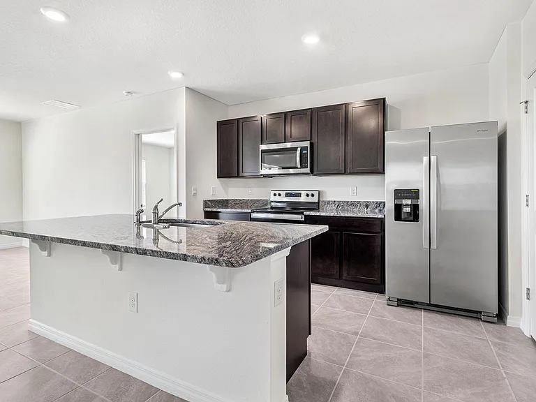 Brand new modern kitchen! Stainless steel appliances, granite counters and plenty of storage.