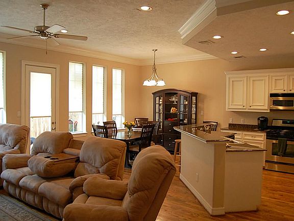 Family room, Kitchen, Breakfast/Dining Area overlooks back patio.