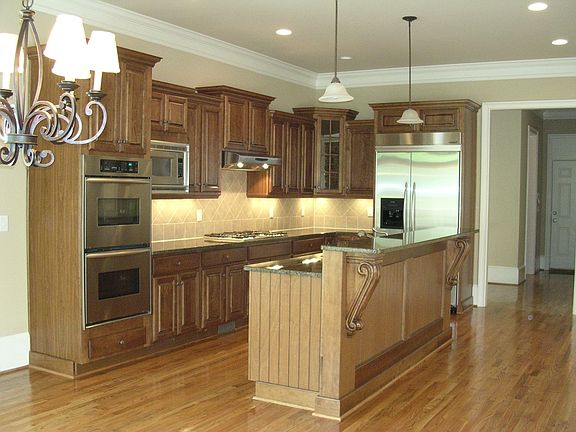Gourmet Kitchen w/stainless appliances, fridge stays,double ovens, gas cooktop