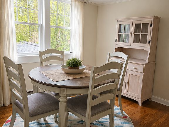 The dining area is hard wood floors and large enough to accommodate a round table and sideboard. Southern facing windows are great for natural sunlight.
