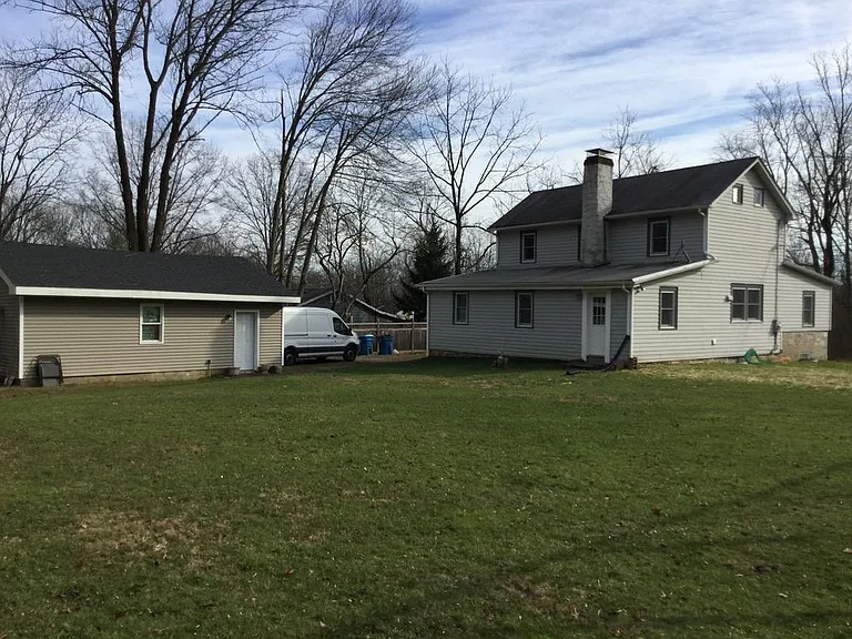 House from back tard showing detatched garage.