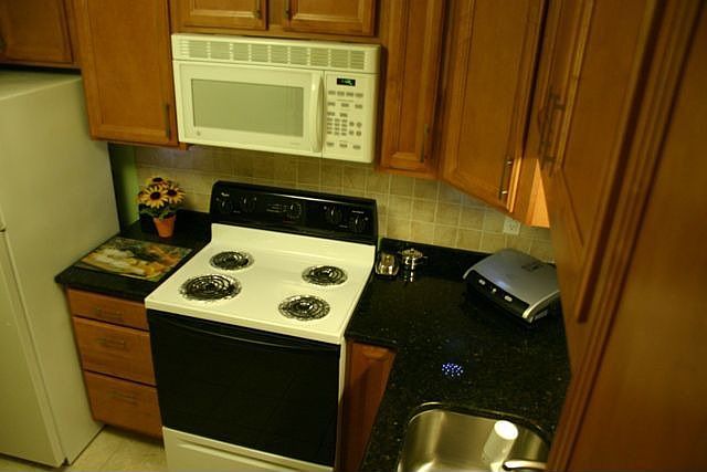 Renovated kitchen - new cabinets, ceramic tiles floor,new dishwasher