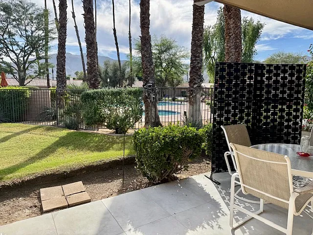 Back patio with pool/spa in rear.