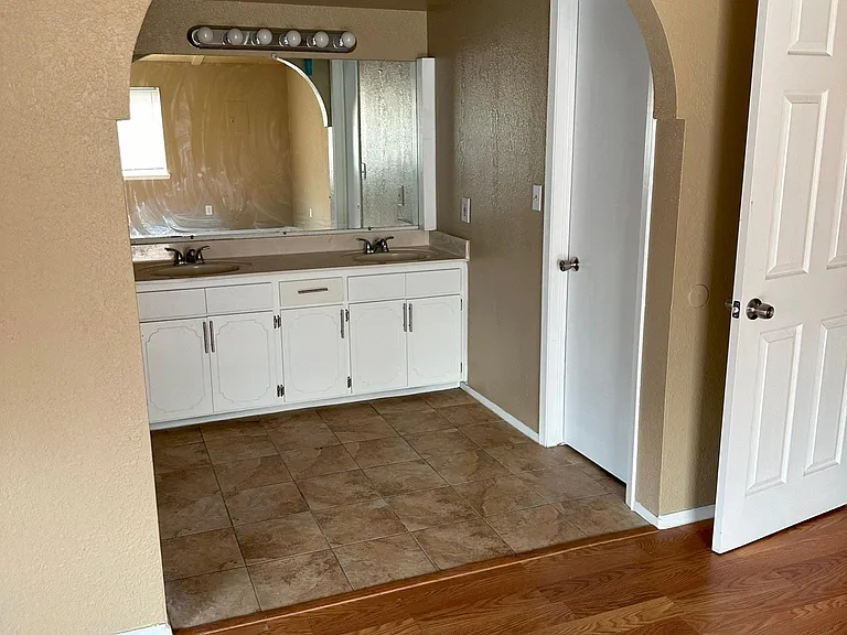 Master bedroom vanity and large walk in closet
