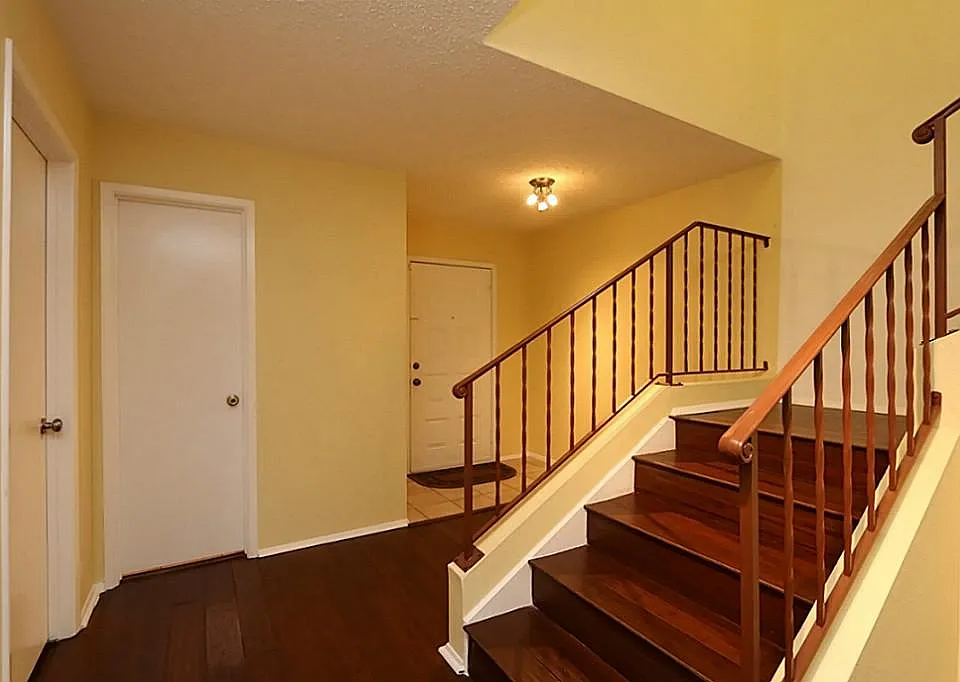 Hardwood floors in most of the first floor and stairs. View