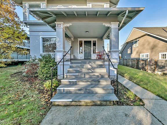 The front entry porch is gracious and a nice place to sit and sip a cup.