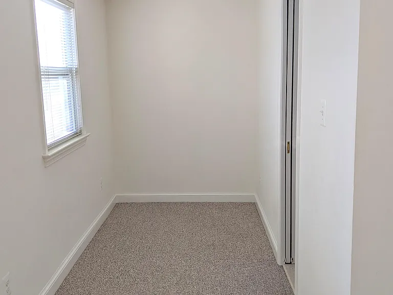 Bedroom: door to en-suite bathroom is on right. This area can be work or sitting space