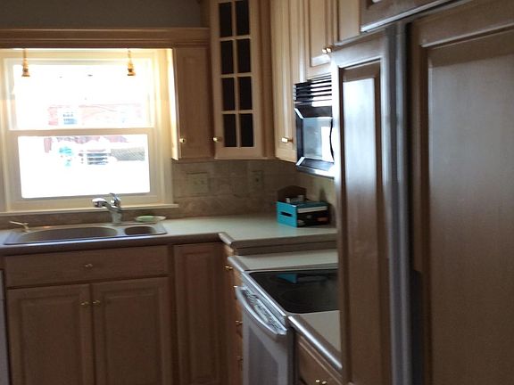 Updated kitchen and sunny kitchen with views of the backyard.