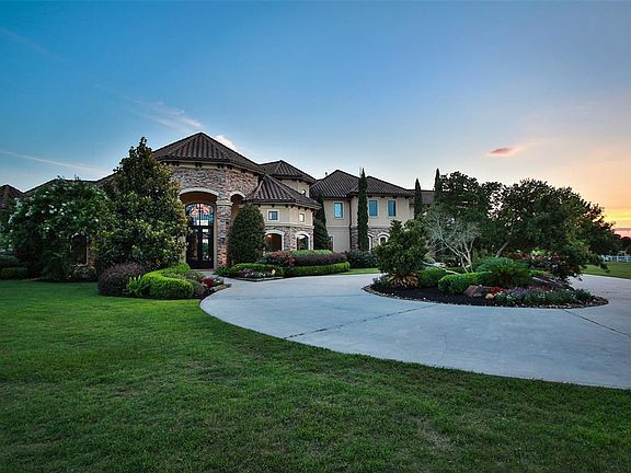 This beautiful property really comes to life in the early dusk hours and exudes such warmth! Peaceful with great curb appeal that includes lush landscaping and mature trees!