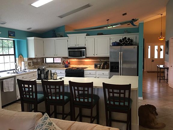 Large island in kitchen (old). Has granite counters.