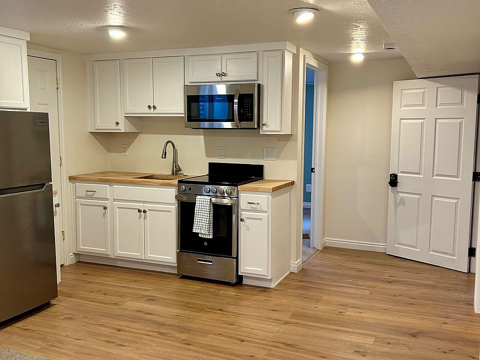 Kitchen with brand new floor, appliances, and cabinets