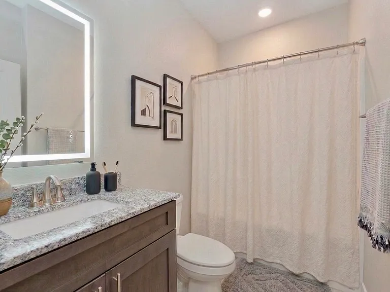 Bright bathroom offering a simple, practical layout for everyday convenience.