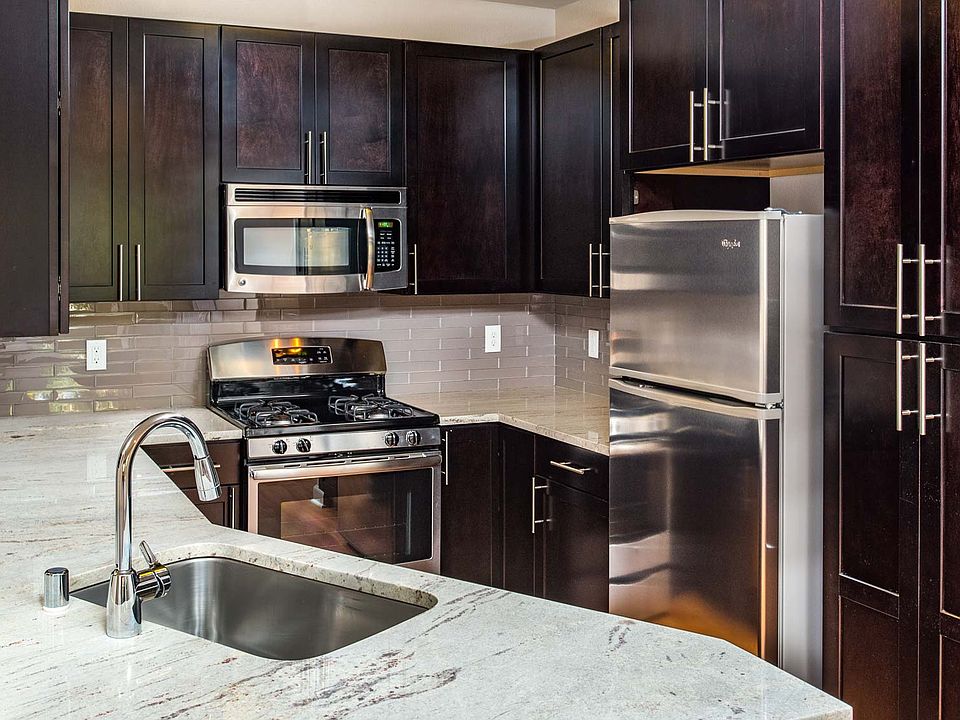 Modern kitchen with stainless steel appliances, granite countertops and premium cabinetry