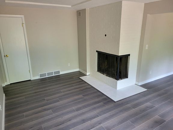 Living room with wood burning fireplace