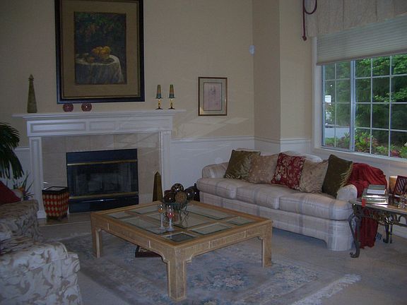 Formal living room with marble fire place