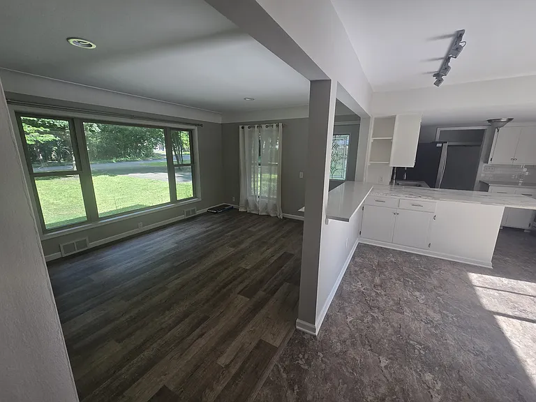 Open concept upper living and dining room with plenty of natural light