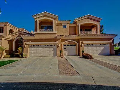Front of condo with 1-car garage