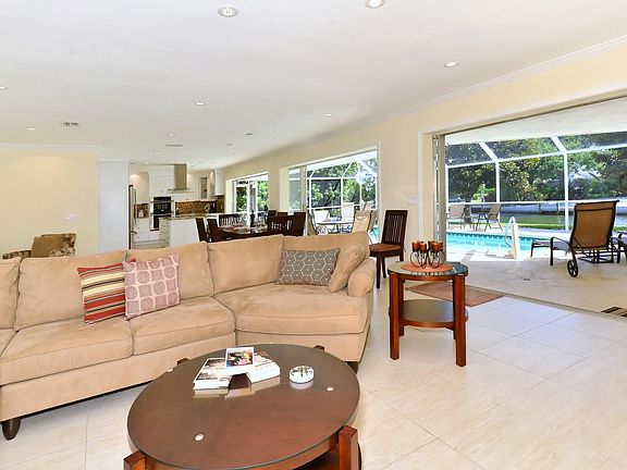 3 large sliding doors fully open to the pool area