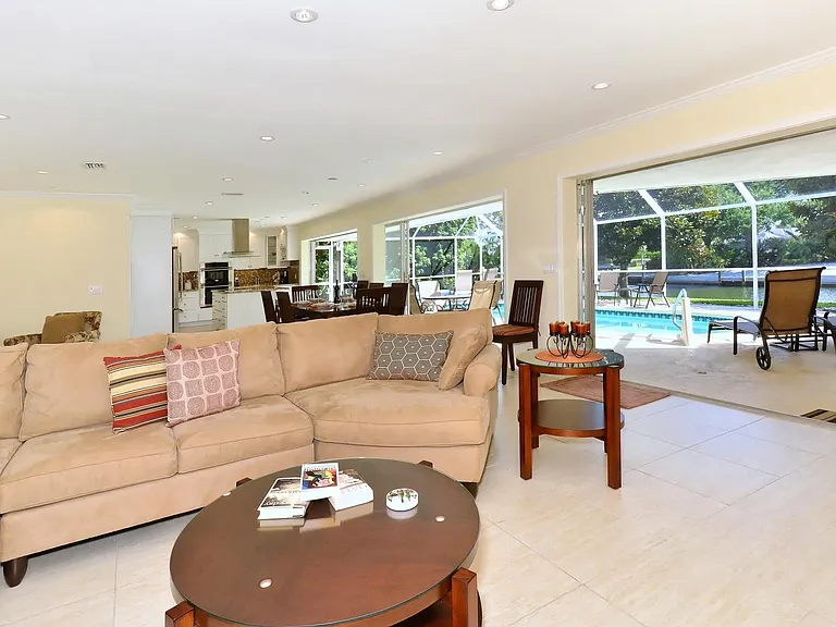 3 large sliding doors fully open to the pool area