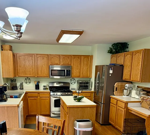 Kitchen with abundant cabinets and island with additional storage