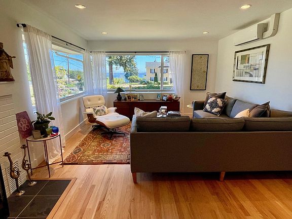 Living room with views of the Puget Sound shipping lanes and Shilshole Bay beyond