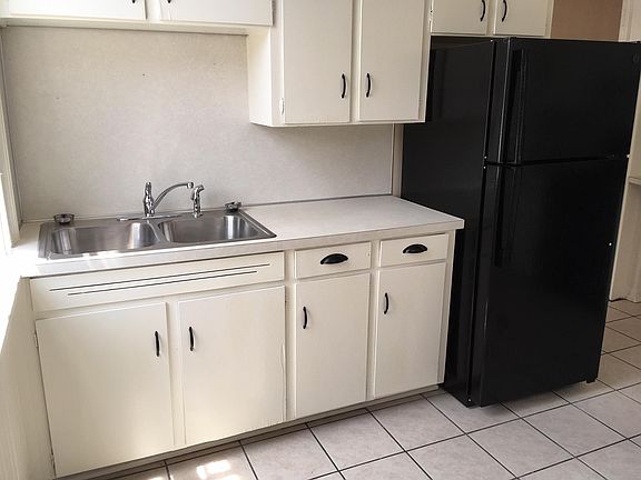 kitchen sink and fridge area