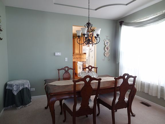 Formal dining room with tray ceiling, large enough for your table and buffet.