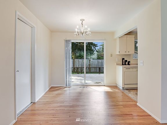 Dining room enjoys slider opening out onto spacious cedar deck