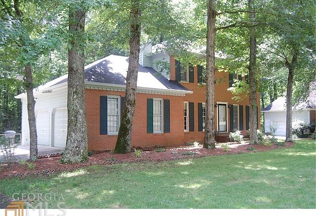 Mature Shade trees on this brick front beauty.