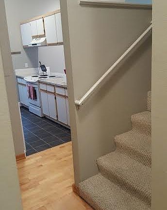 entry in condo, loft to right