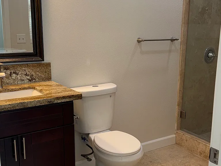 Downstairs Full Bathroom with shower connected to downstairs Bedroom