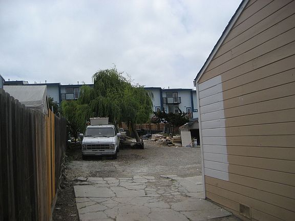 Driveway leading to backyard