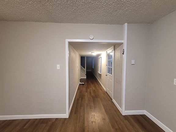 Kitchen/Hallway/Side door leading to deck